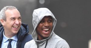 Igahlo in high spirits as he steps out of the Lowry Hotel in Manchester…