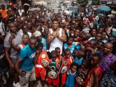 Anthony Joshua poses with Nigerian fans, displays belts