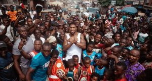 Anthony Joshua poses with Nigerian fans, displays belts