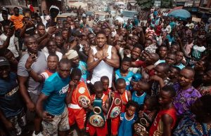 Anthony Joshua poses with Nigerian fans, displays belts