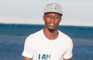 Abu Azeez turns model, models beach soccer shirt