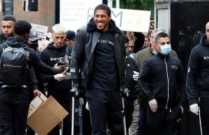 Anthony Joshua hobbles on crutches as he joins Black Lives Matter protest in Watford