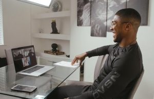 Anthony Joshua watches on as Oleksandr Usyk survives a scare against veteran Derek Chisora to win heavyweight clash by unanimous decision